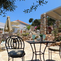 12 Eleni lower level sun terrace with sun beds, table and chairs