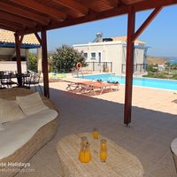 10 Kera View pool terrace shaded lounge and dining area, and barbeque cabana