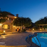 05 Villa Prinolithos pool terrace and ground floor apartment at dusk